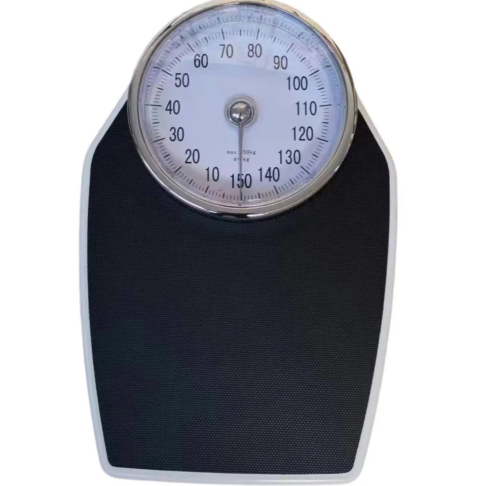 Black mechanical bathroom scales with large analogue dial showing weight measurements
