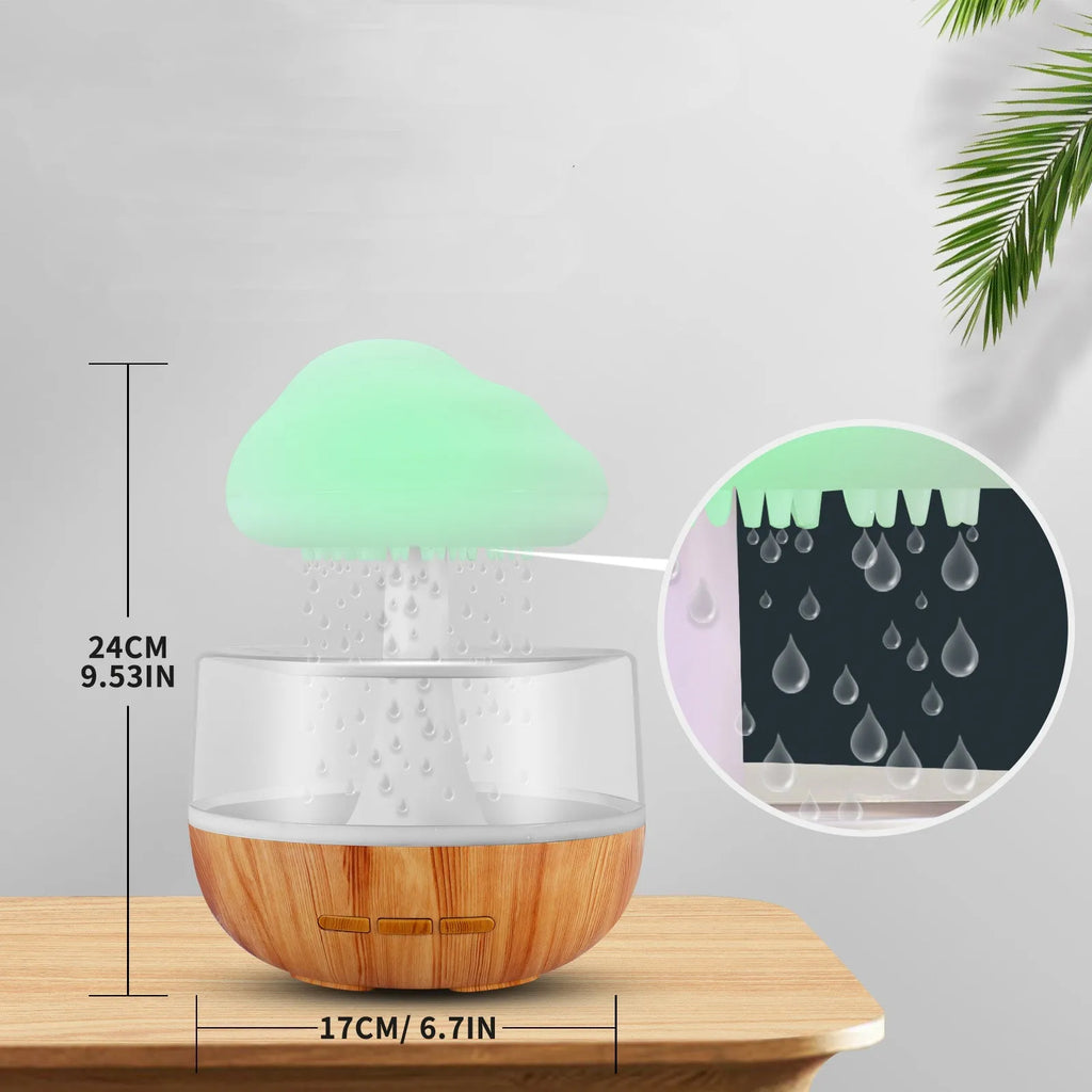 White raining cloud humidifier with night light and essential oil diffuser on table