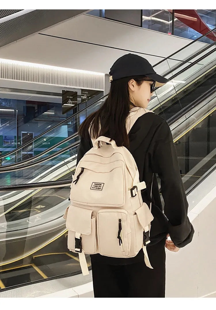Black and white nylon student backpack with laptop compartment and three-dimensional pockets