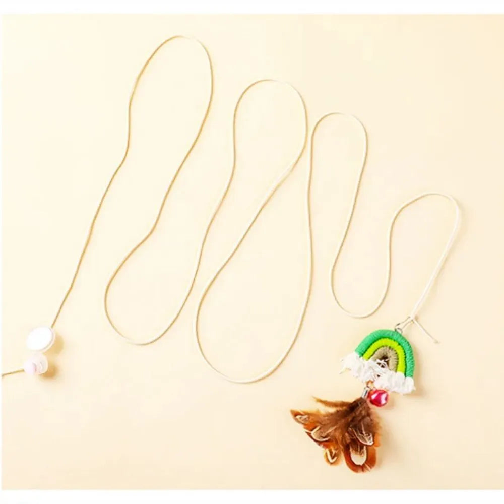Blue elastic cat teasing stick with feather rope hanging from a door via a sticky buckle clamp