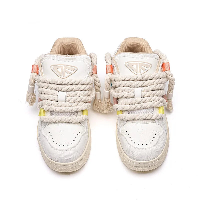 Creamy white Old Damage retro lace-up skateboard shoes with platform sole on a plain background.