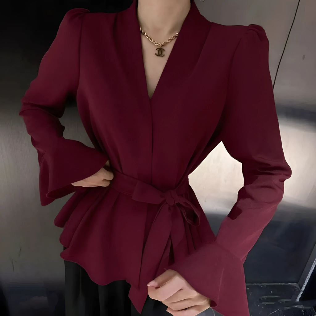 Women's French-style irregular collar long sleeve shirt with bell sleeves and a tie front.