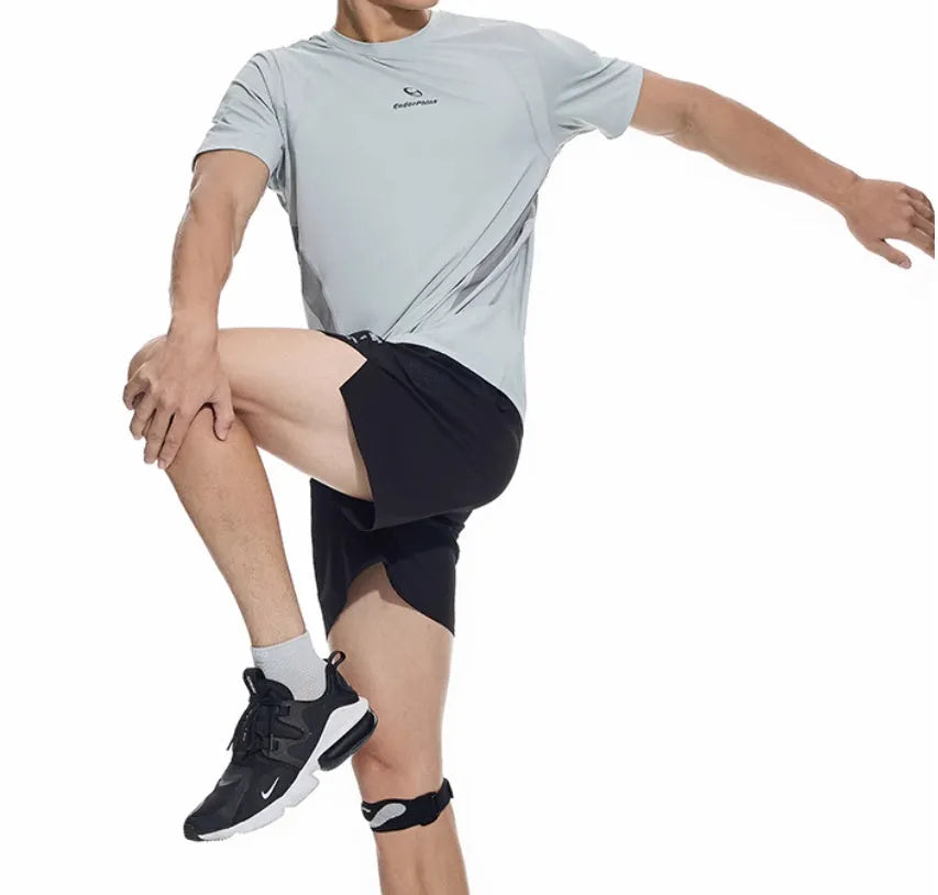 Men's black running shorts with laser stitching detail on a grey background