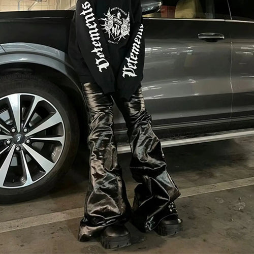 Black women's skinny jeans with a shiny patent leather coating and straight-leg style.