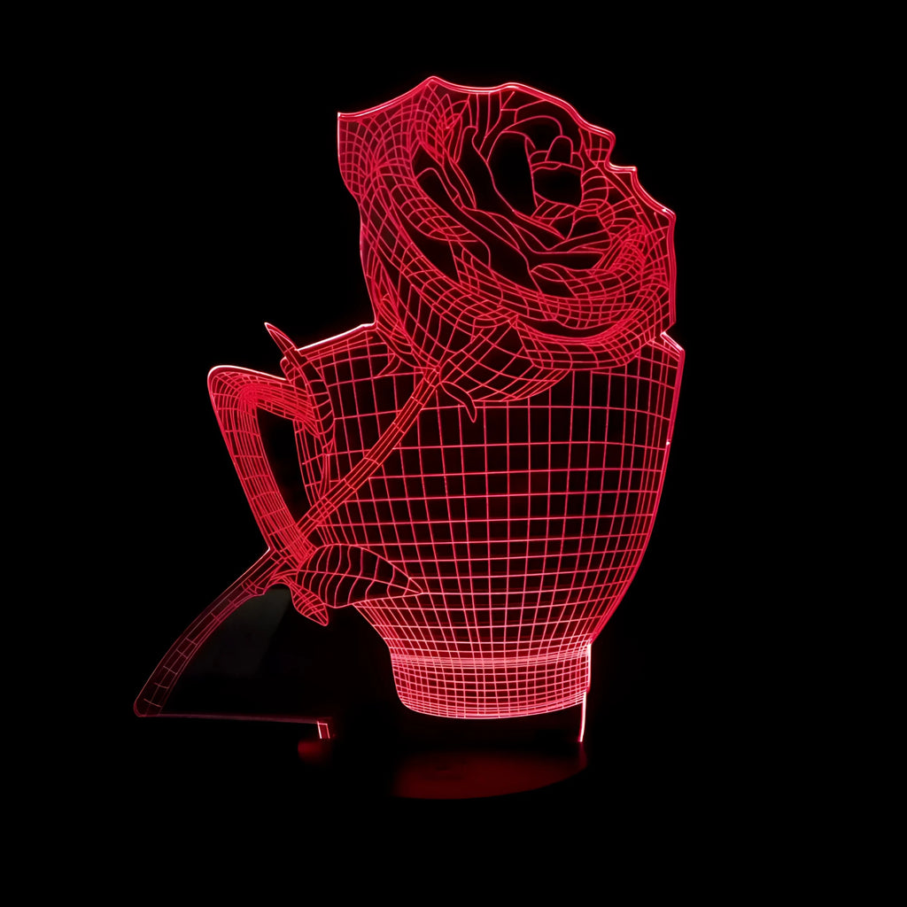 3D rose design acrylic night light with ABS base on a table, showing multi-coloured LED illumination.