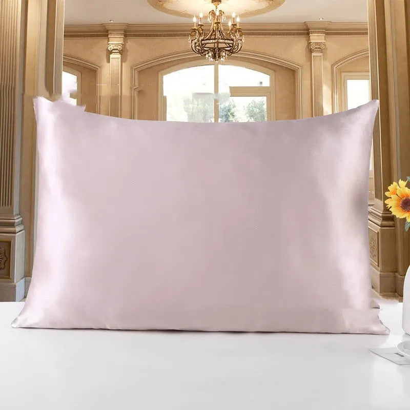 19 M double-sided silk pillowcase in apricot colour showing smooth texture and hem detail.