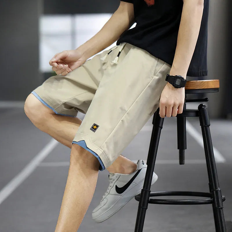 Men's loose-fit Korean-style casual beach shorts in blue, available in sizes up to 8XL.