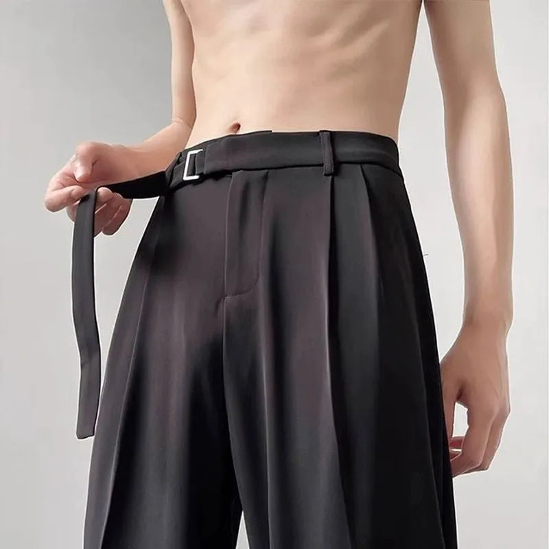 Thin straight black wide leg loose trousers laid flat, showing non-ironing casual style.