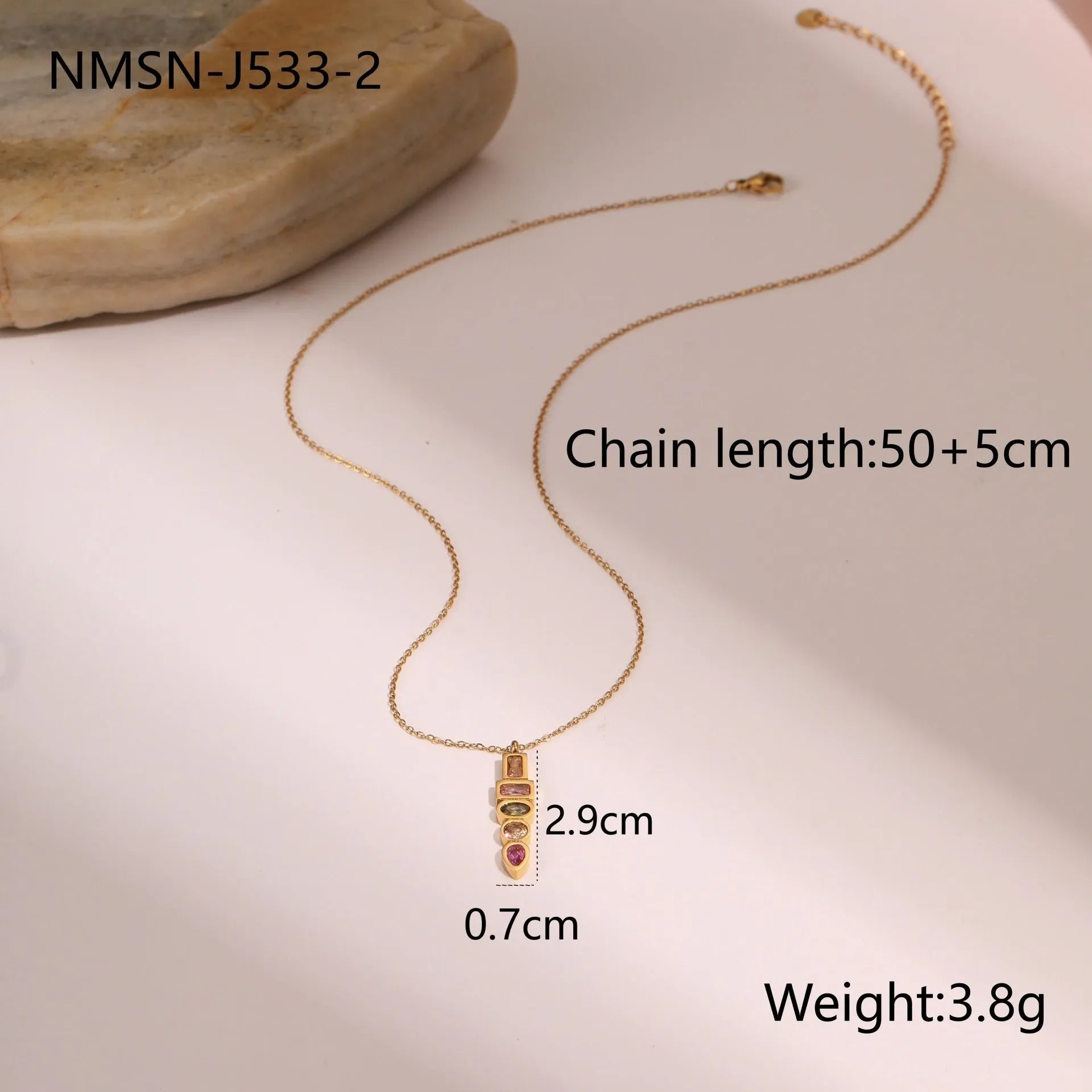 Geometric gold-plated jewellery set showing necklace, ring, and earrings on stainless steel with 18K plating