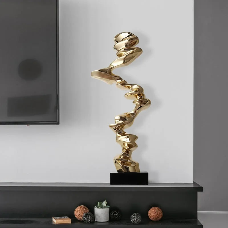Minimalist abstract resin decorative sculpture in bright gold, silver, or blue.