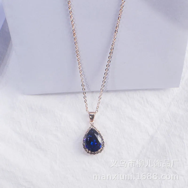Pink water drop geometric necklace with rose gold electroplating and rhinestone detailing on alloy pendant