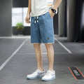 Men's loose-fit Korean-style casual beach shorts in blue, available in sizes up to 8XL.