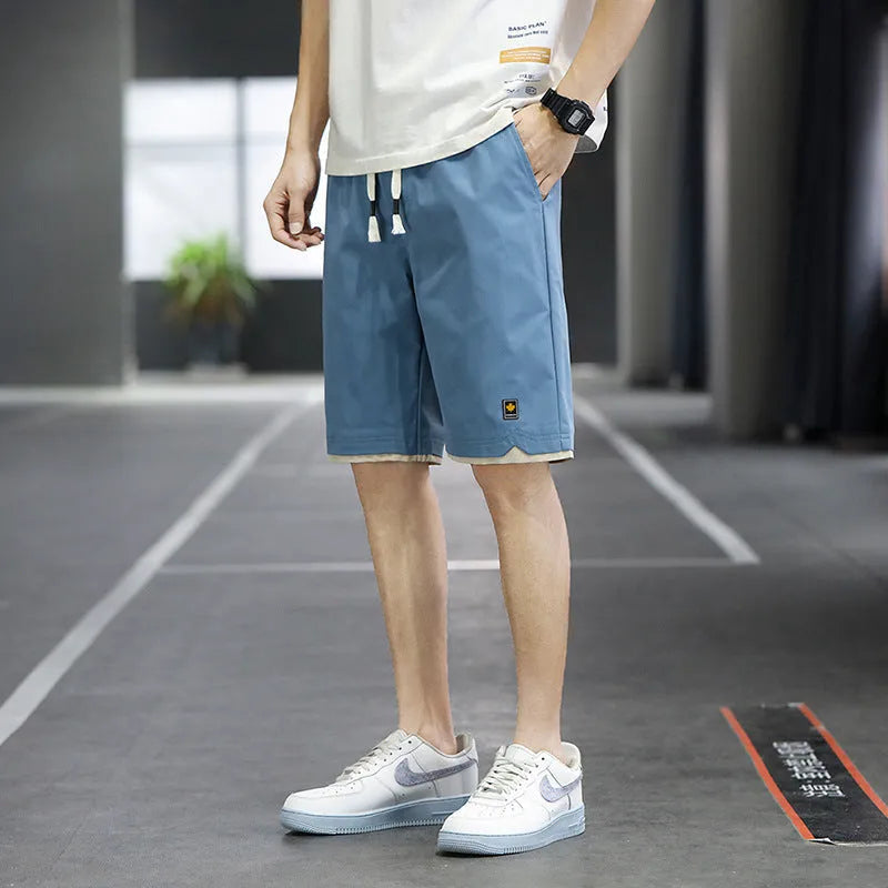 Men's loose-fit Korean-style casual beach shorts in blue, available in sizes up to 8XL.