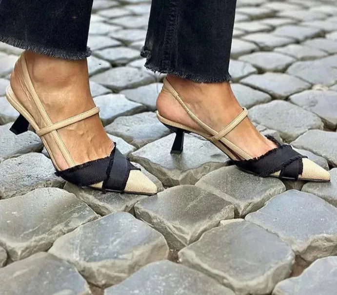 Women's apricot and black colour block stiletto sandals with pointed toe and buckle fastening.