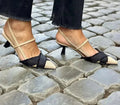 Women's apricot and black colour block stiletto sandals with pointed toe and buckle fastening.