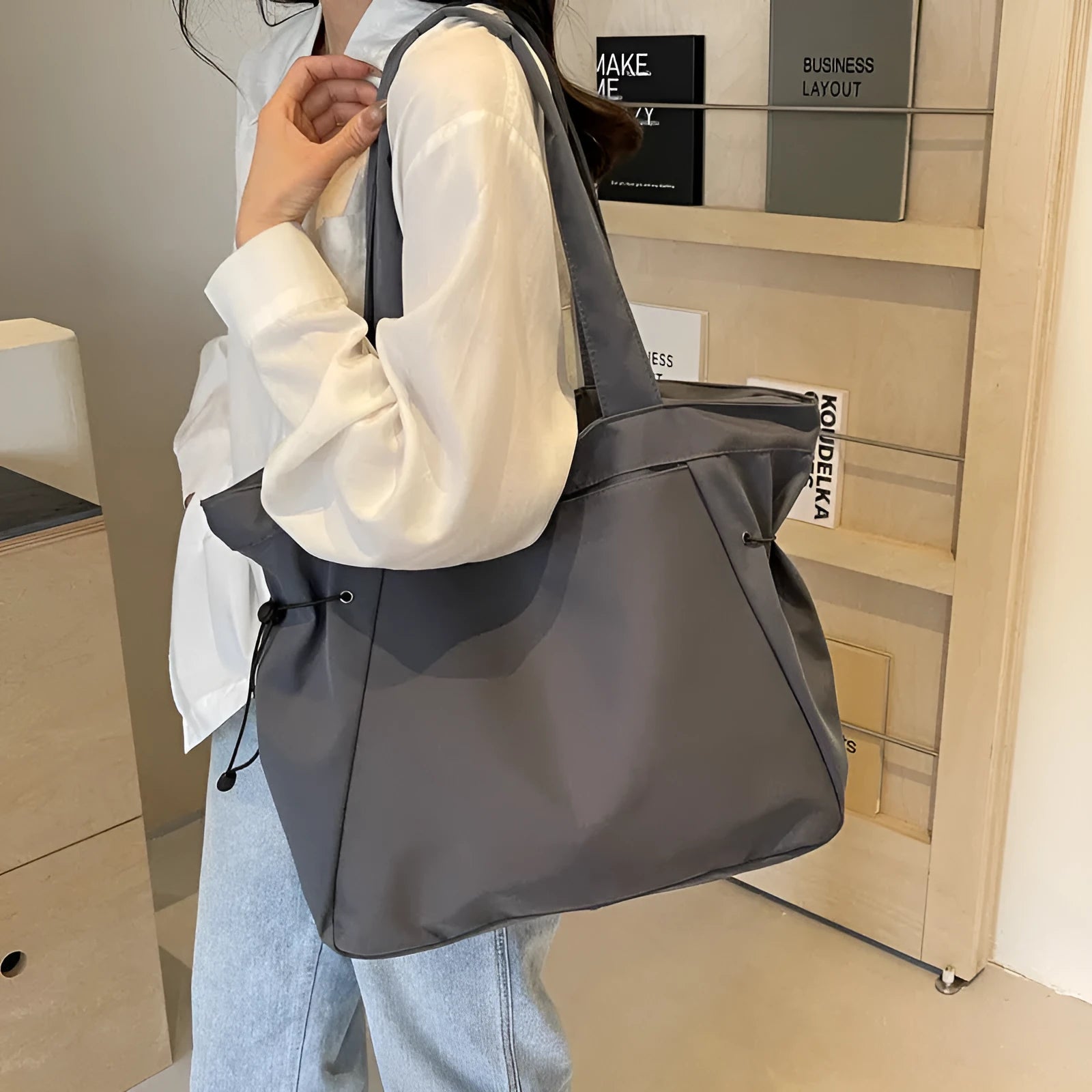 Soft oxford cloth folding commuter tote bag in street style, shown in black, grey, brown, and purple colours.