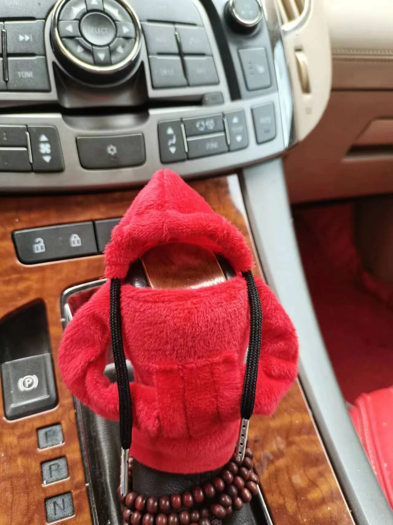 Soft Dutch velvet car gear handle cover in multiple colours on a gear stick.