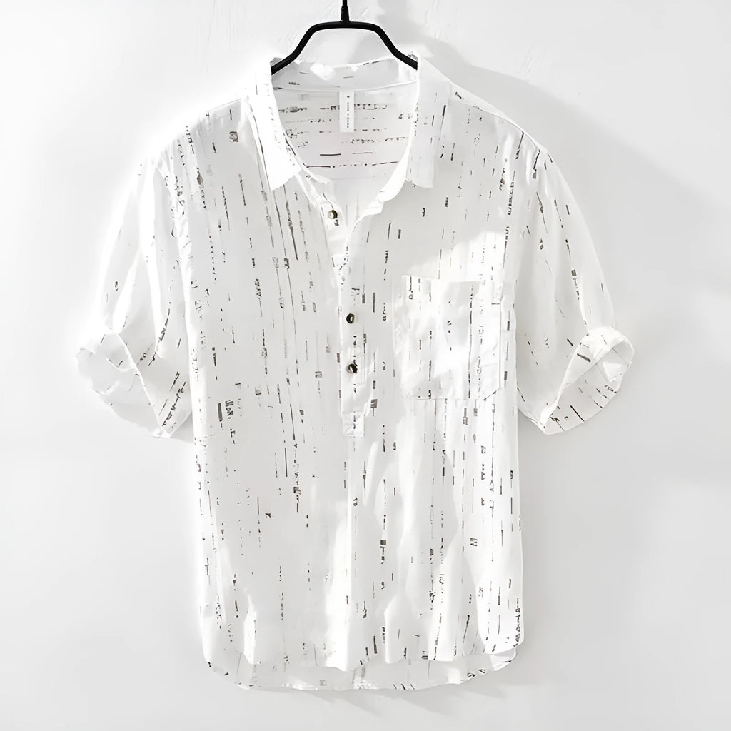 A man's loose-fitting black lapel polo shirt with short sleeves on a hanger.