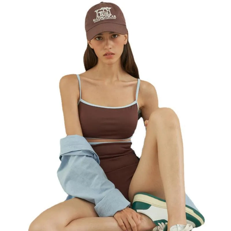 Brown triangle-style one-piece swimsuit for women on a hanger.
