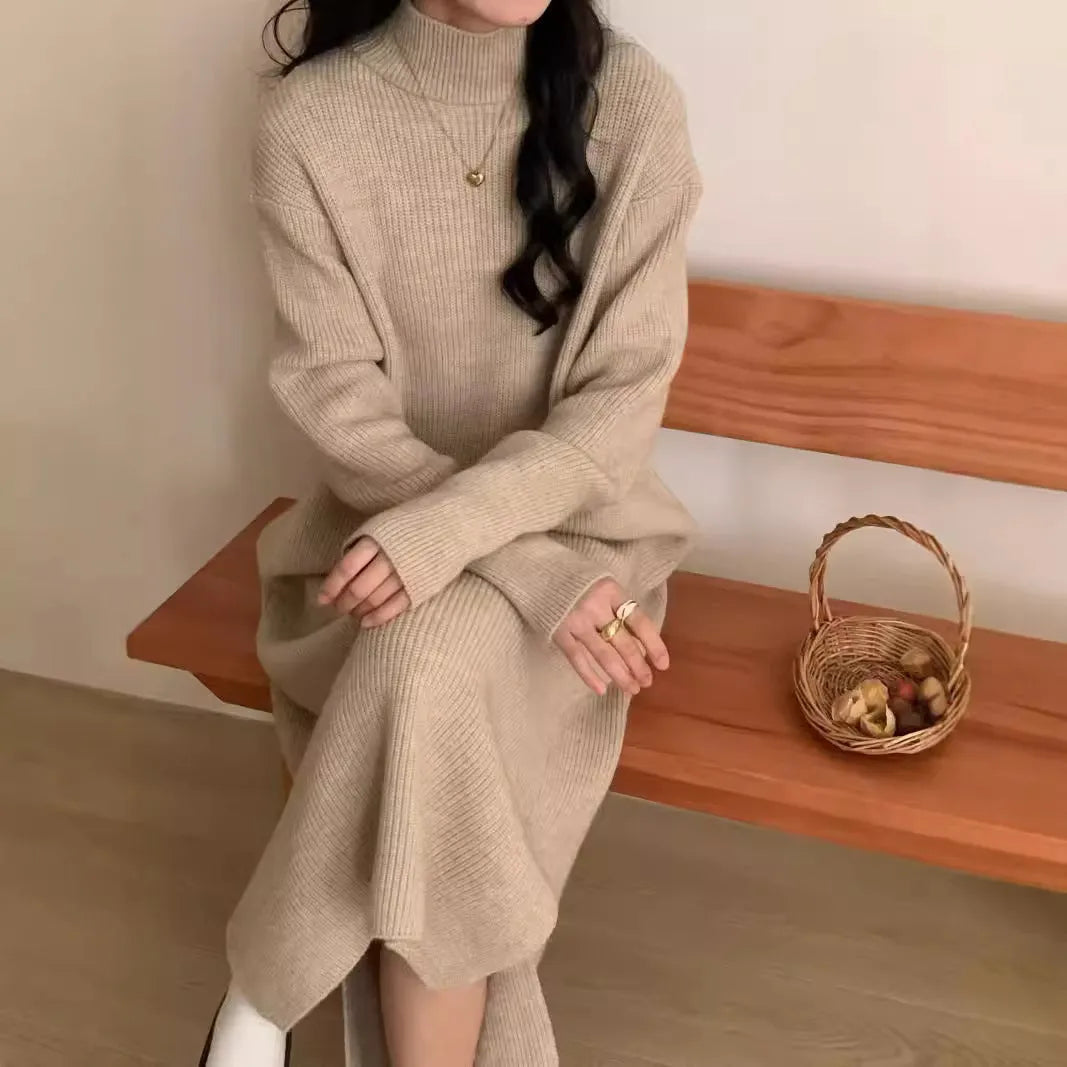 Acrylic half turtleneck long sleeve knit dress in a knee-length midi style, shown in a neutral colour.