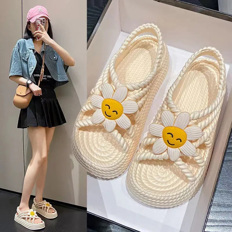 Women's floral decorated PVC sandals in beige or black with non-slip soles