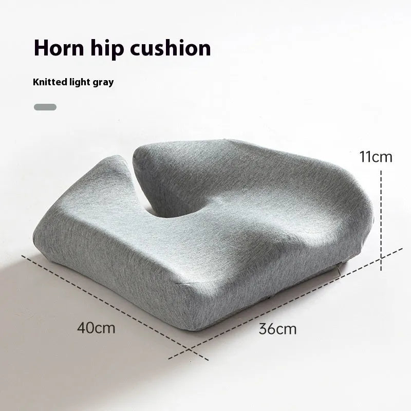Black memory foam office chair cushion with dimensions 36x40cm on a grey desk chair