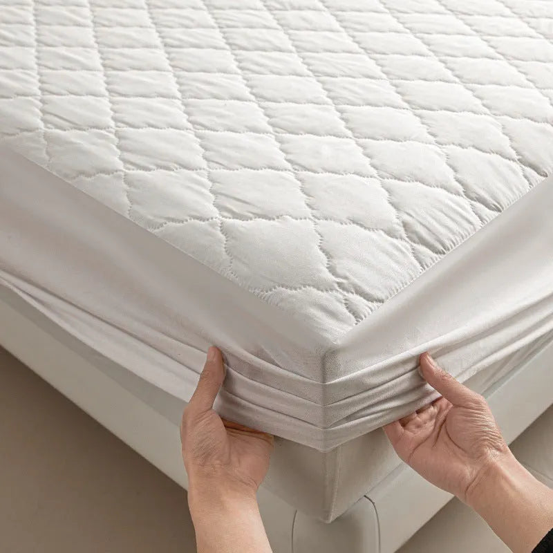 Diamond lattice quilted waterproof mattress protector set with bamboo fibre fitted sheet and pillowcases.