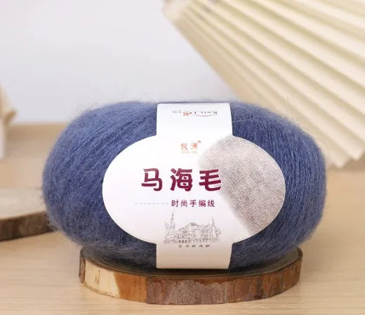 Single ball of mohair yarn in various colours for hand-woven DIY scarf knitting projects
