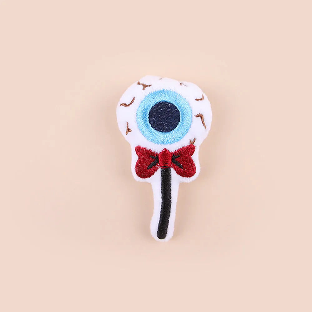 Colourful plush cat teaser wand with candy, eyes and skull animal shapes for interactive play