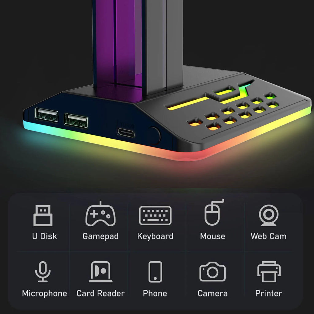 RGB colour changing headphone display stand with dual USB ports on a desk