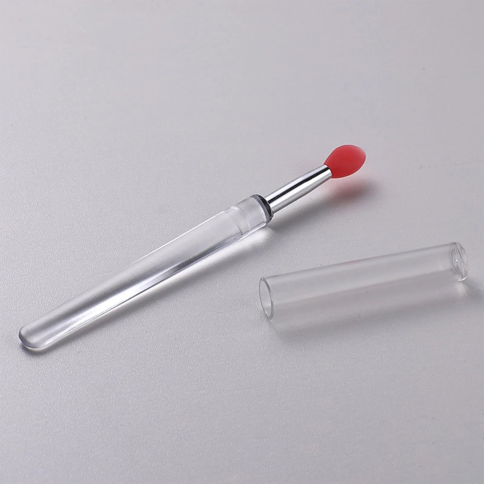 Set of reusable silicone lip brushes with protective caps in various colours