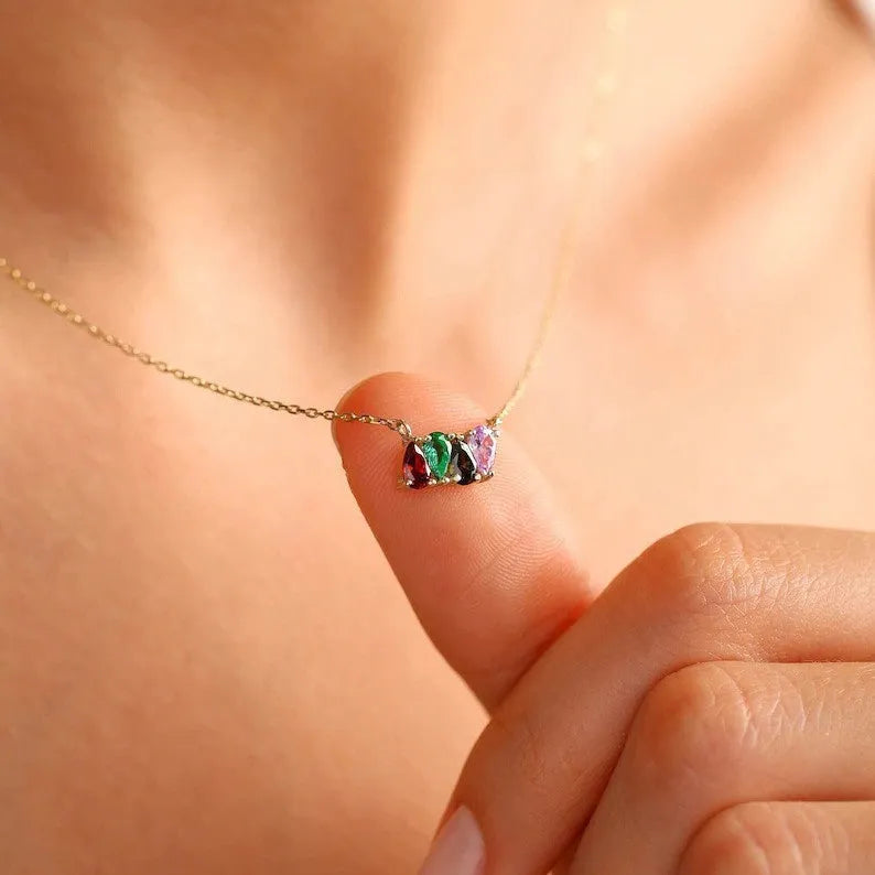 Titanium steel birthstone necklace with zircon stones in silver, gold, or rose gold on a model.