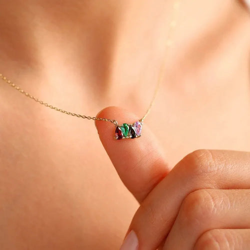 Titanium steel birthstone necklace with zircon stones in silver, gold, or rose gold on a model.