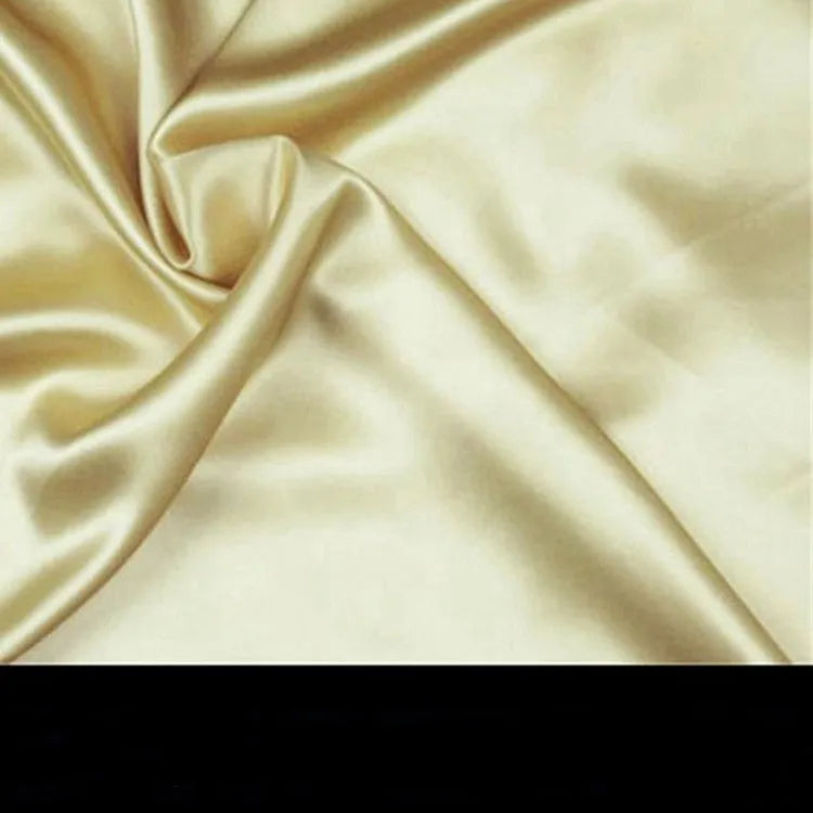 19 M double-sided silk pillowcase in apricot colour showing smooth texture and hem detail.