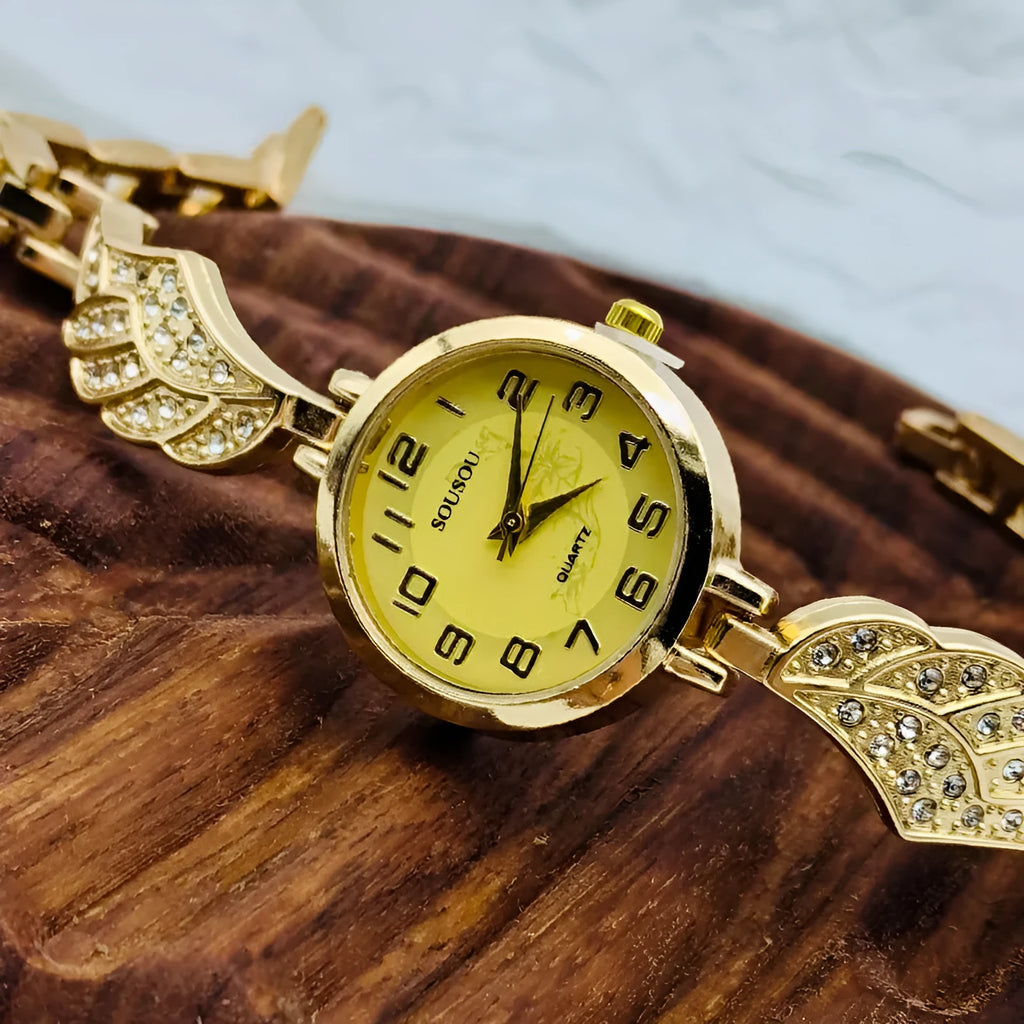 Women's stainless steel fashion watch with round gold dial and vachette clasp.