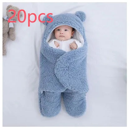 Cotton blend quilted baby sleeping bag wrapper in light blue, shown laid flat.