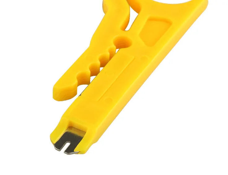 Yellow portable wire stripper tool with metal snap-in frame, showing 0.6 mm stripping diameter for network cables.