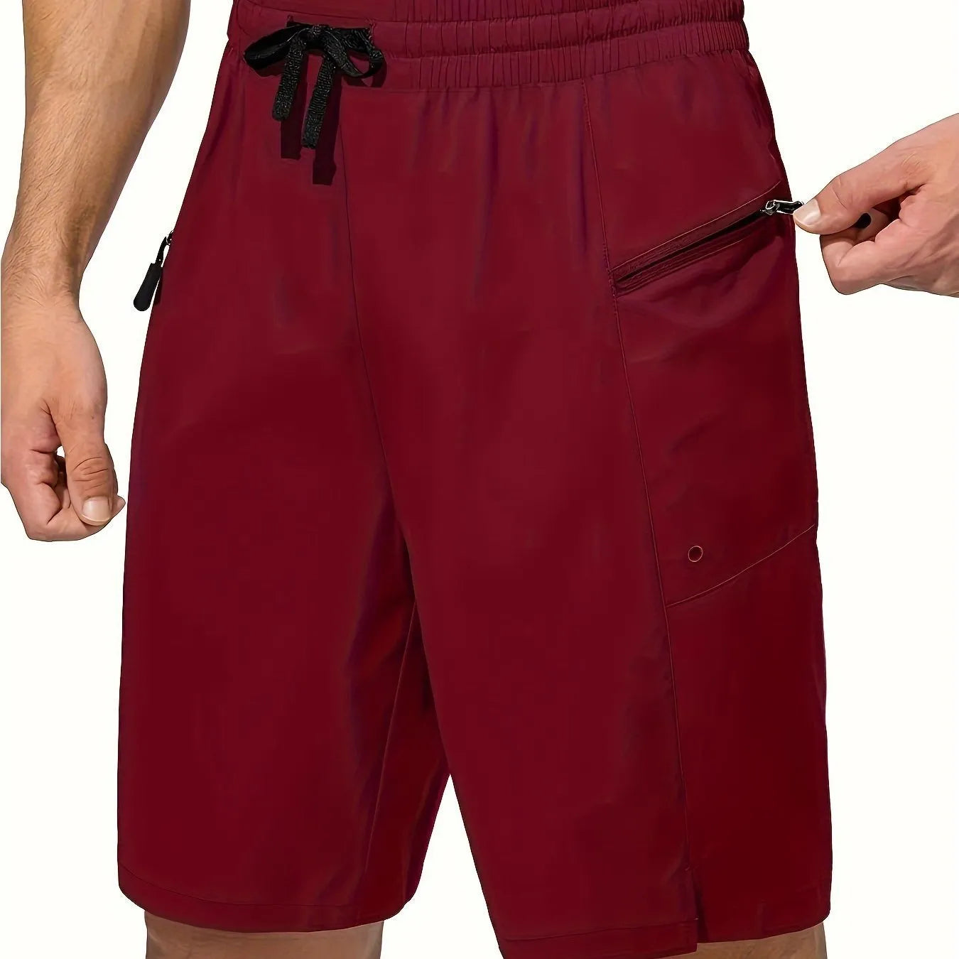 Man wearing solid grey quick-drying polyester beach shorts with a straight leg design.