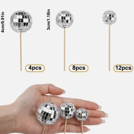 Glass disco ball cake decoration on a wooden stick, shown in different sizes for cake topping.