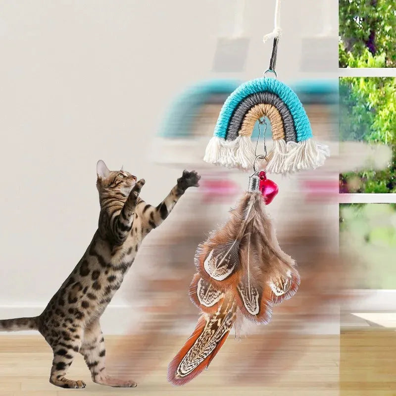 Blue elastic cat teasing stick with feather rope hanging from a door via a sticky buckle clamp