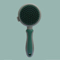 Double-sided cat brush with smooth brush and flea comb on reverse sides, showing release button mechanism