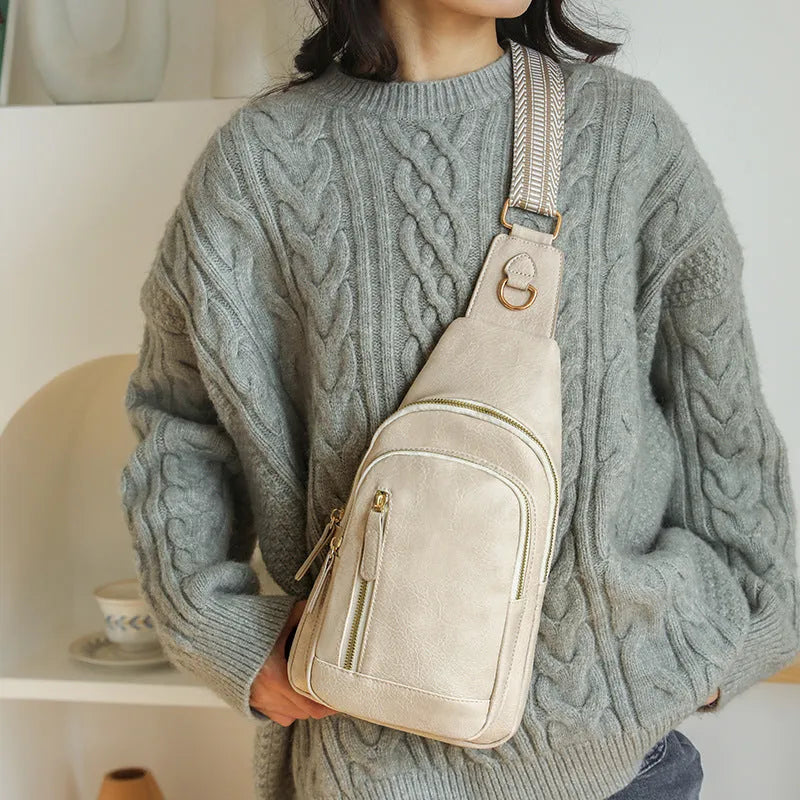 Women's soft brown PU crossbody chest bag showing open outer pocket and street style design