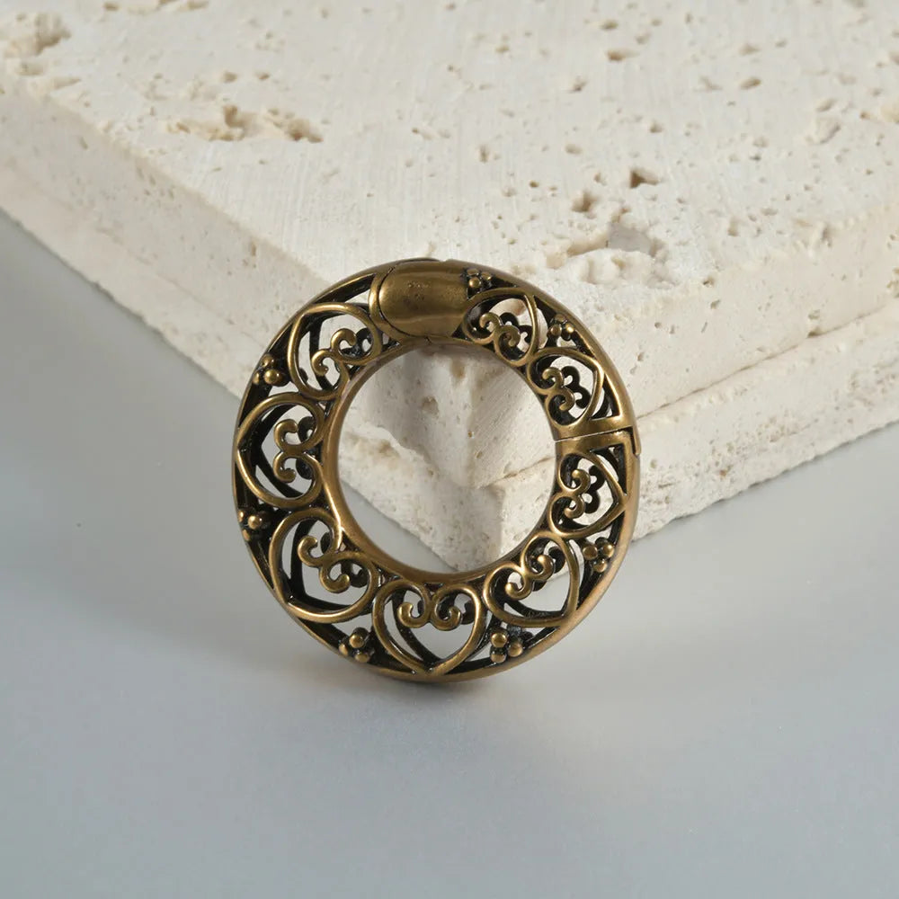 Retro hollow heart and lotus magnetic earrings in antique silver and gold finishes