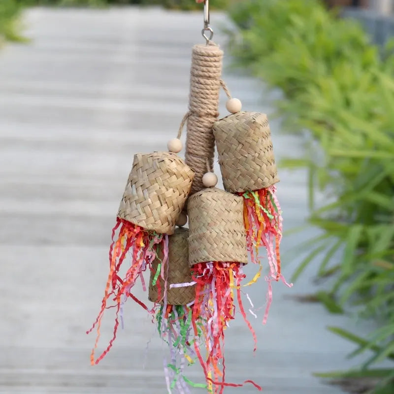 Colourful shredded paper parrot toy made of wood and sisal rope, measuring 35cm long.