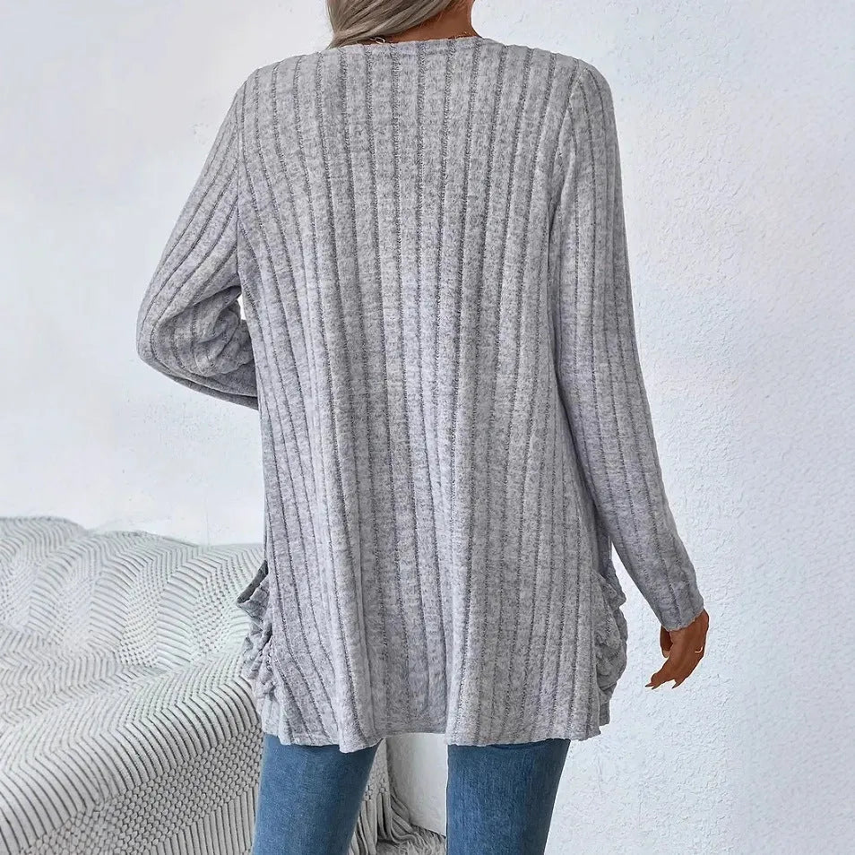 Women's loose-fit long sleeve cardigan with pockets in granny grey, shown on a hanger.