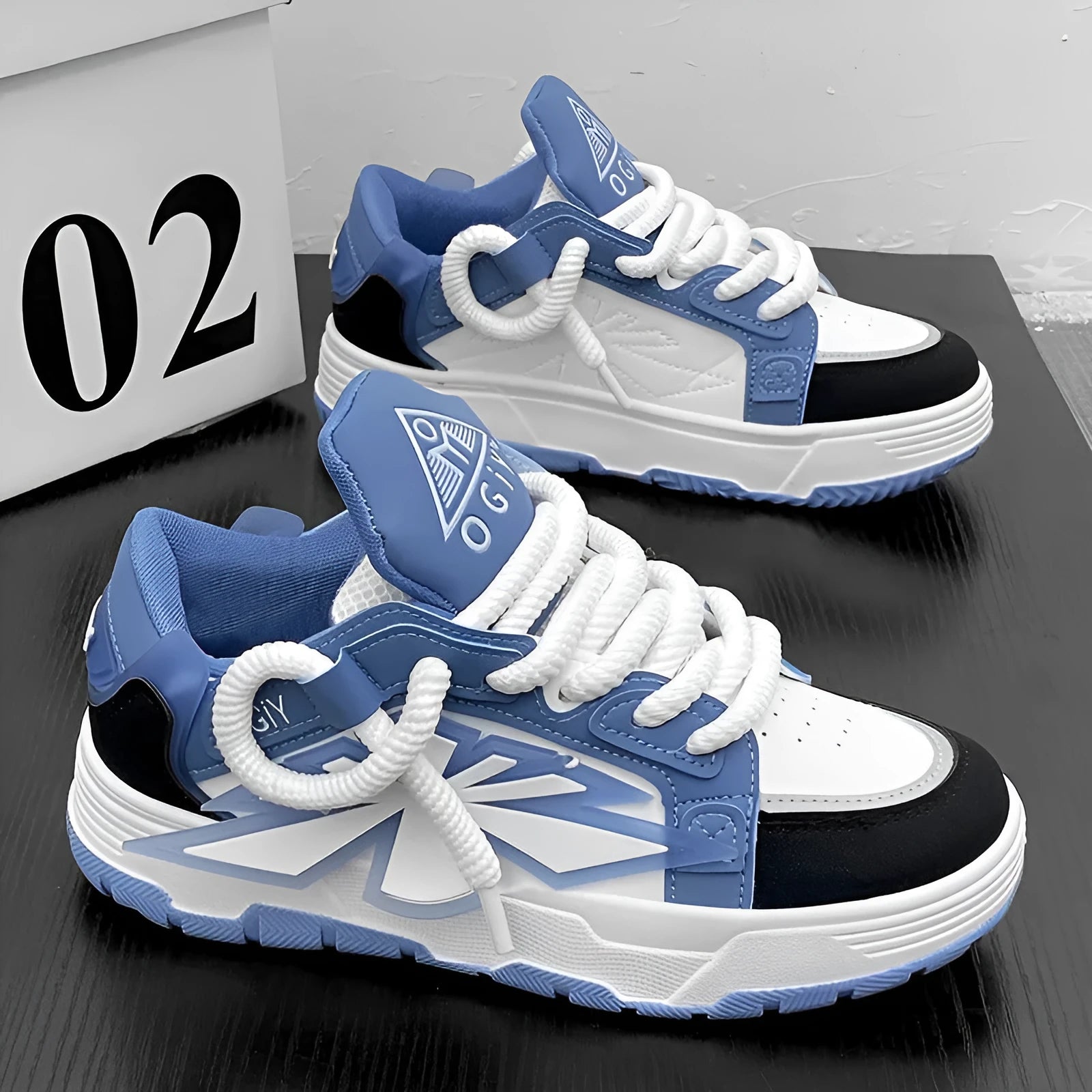Men's white chunky sneakers with a cartoon totem pattern on the synthetic leather upper and a thick rubber sole.