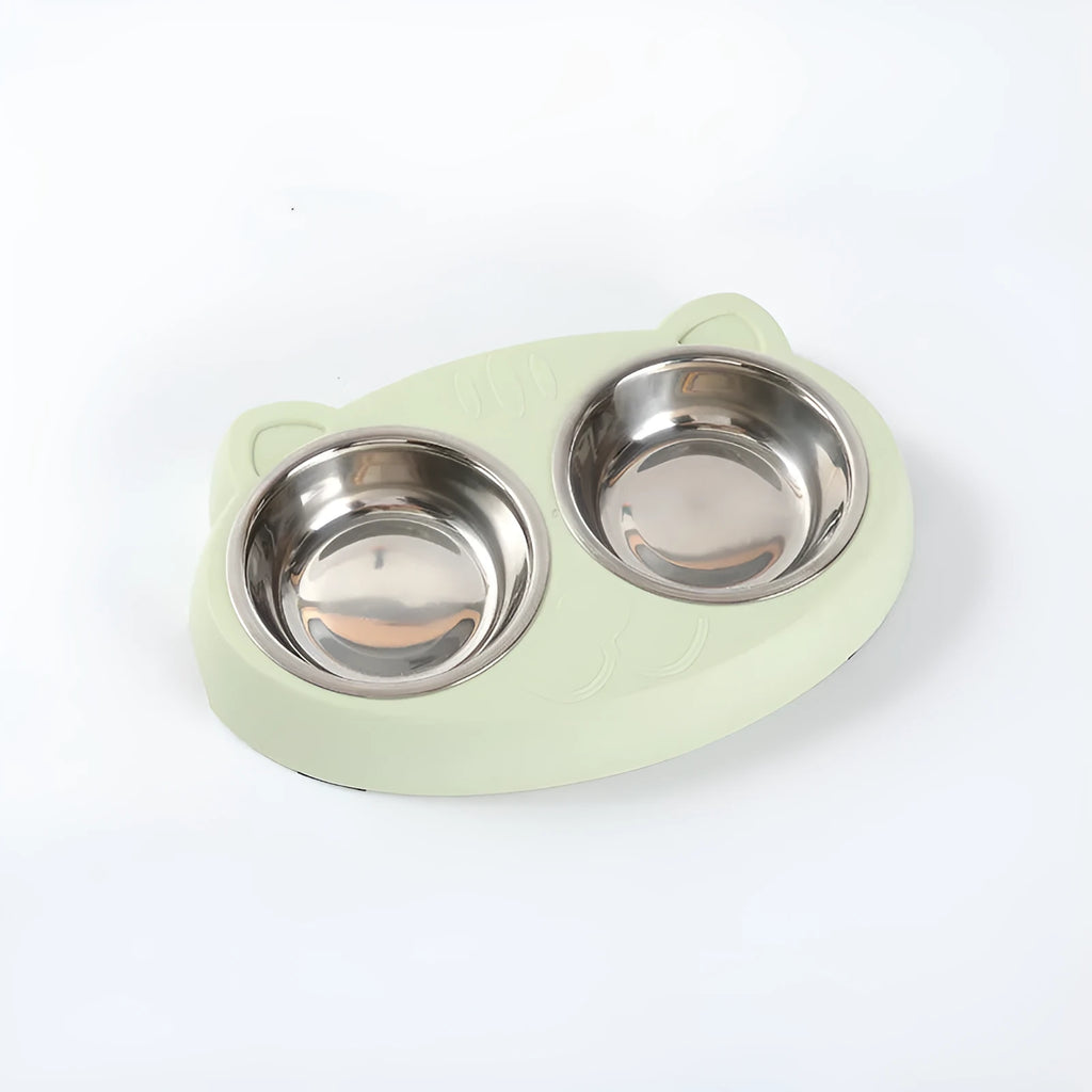 Blue plastic double bowl pet feeding tray for cats and dogs with non-slip rubber feet on a floor.
