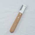 Pet stripping comb with wooden handle and metal teeth for removing hair from dogs and cats.