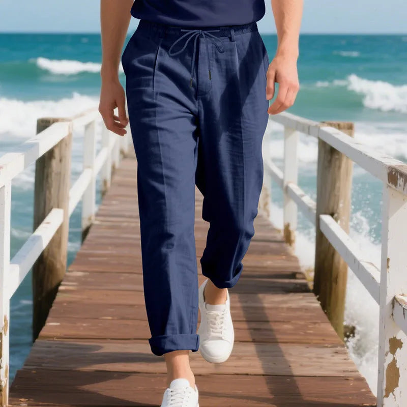 Men's light khaki linen casual trousers with a loose straight-leg fit and drawstring waist.