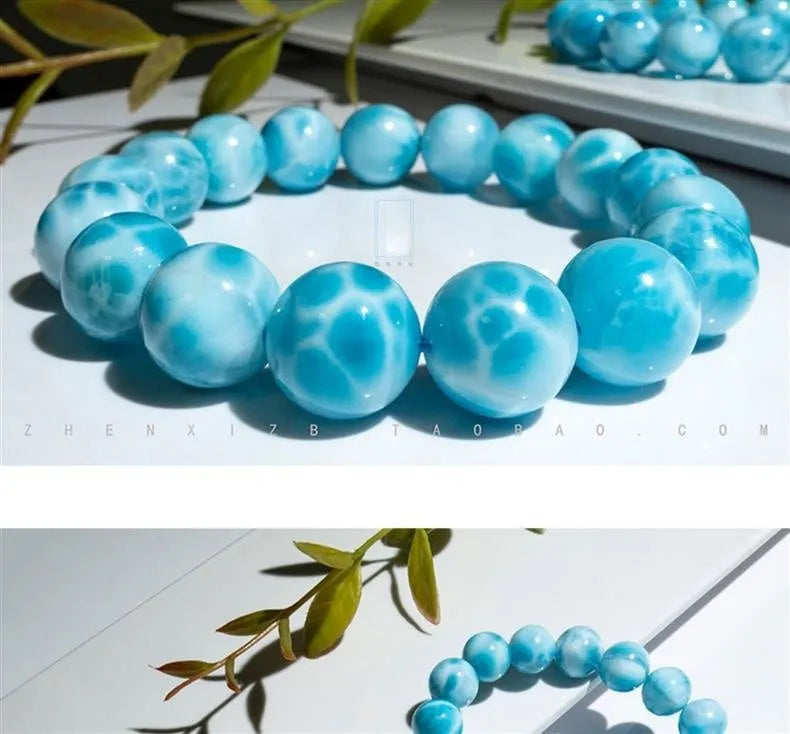 Blue Maillard style Bodhi bracelet with a natural sea-pattern crystal stone and pearl beads on wrist.